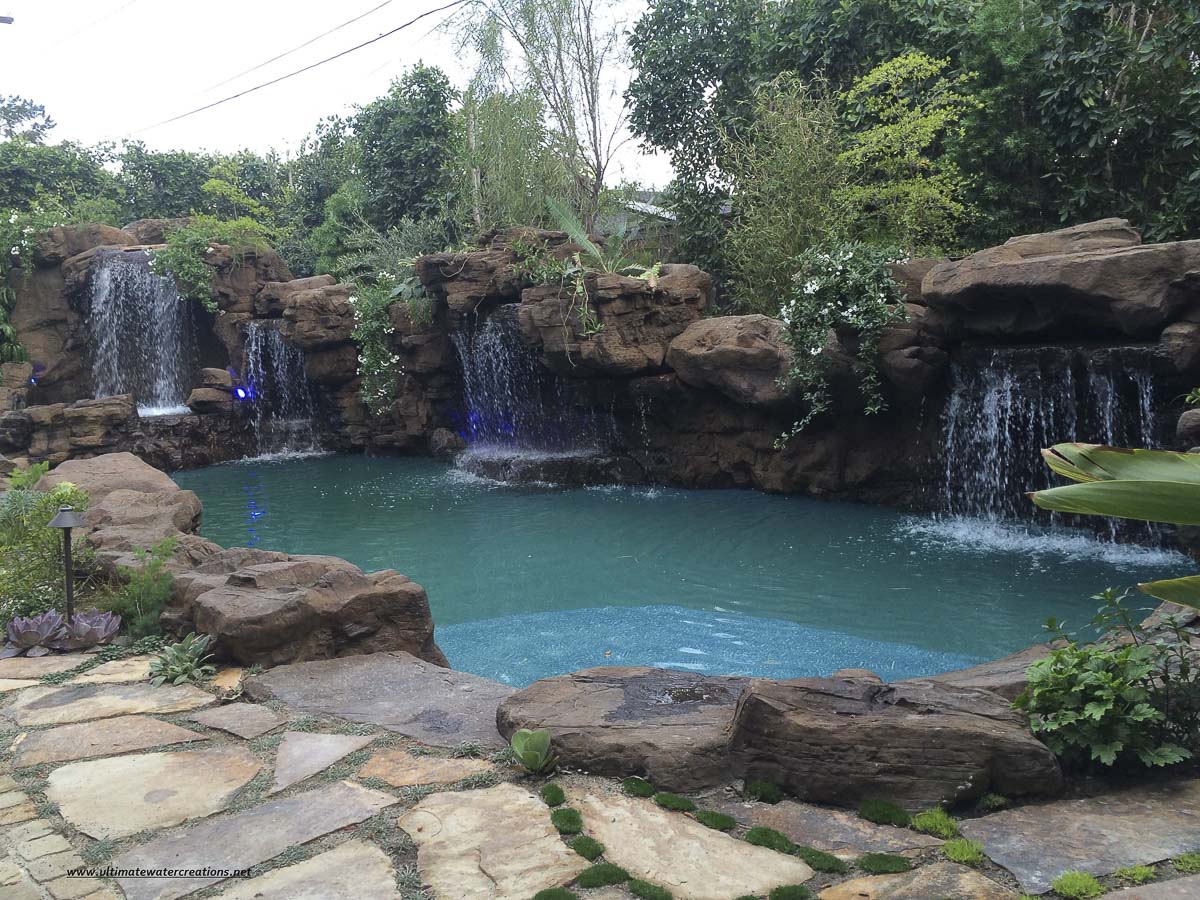 View from inside a rock grotto over a pool